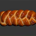 Delicious Braided Bread Loaf With Glazed Red Brown Surface And Sugar Topping