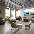Car Dealership Showroom Displaying Various Colored Cars Comfortable Chairs Large Windows And Screen