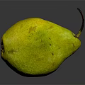 Ripe Yellow Pear With Speckled Skin On Dark Reflective Surface