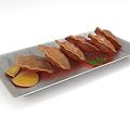 Delicious Pan Fried Dumplings on Gray Rectangular Plate with Lemon Slices and Parsley Garnish