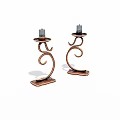 Copper Candle Holders With Curved Spiral Design And Candles On Decorative Base