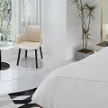 Modern Hotel Room Interior With Comfortable Bed Nightstand Armchair And Geometric Rug
