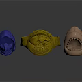 Decorative Ornaments Including Blue Helmet Gold Dragon Ring And Brown Creature Head