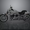 Sleek Modern Motorcycle With Silver Body Black Seat And Shiny Engine On Reflective Surface