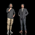 Two Men Standing Against Black Background In Casual And Formal Clothing