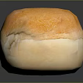 Fresh Golden Crusty Bread Loaf With Soft Interior On Black Surface