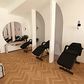 Modern Shop Front Desk Area With Computer Curved Door Round Mirror And Herringbone Floor