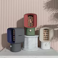 Colorful Modern Small Electric Appliances On Marble Base With Striped Wall And Green Plant