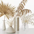 Decorative Vases in Various Shapes With Golden Palm Leaves Dried Leaves and White Flowers