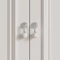 Modern Door Handles with Silver Bases and White Marble Spherical Knobs on White Paneled Doors