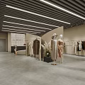 Modern Retail Store Interior With Clothing Racks Sofa Area Fresh Flowers And Ceiling Lights
