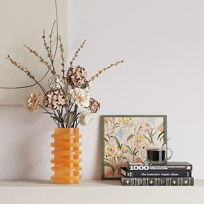 Orange Ribbed Vase With Brown And White Dried Flowers On Table With Floral Art Books 3d model