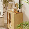 Cozy Living Room With Rattan Chair Plants And Wooden Cabinet