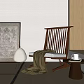 Wooden Lounge Chair with Striped Backrest Throw Blanket Small Table Floor Lamp and Green Plants