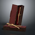 Antique Bone Carved Weapon Displayed in Open Red Decorative Box with Gold Accents