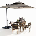 Outdoor Wooden Table And Woven Chair Set With Umbrella Flowers And Decorative Bottles