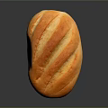 Freshly Baked Golden Oval Bread Loaf With Scored Surface And Crispy Crust