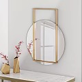 Elegant Round Mirror With Golden Frame On White Marble Tabletop And Red Branches In Vase
