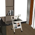 Modern Wheeled Side Table With Potted Plant And Magazines In Living Room