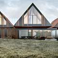 Modern Single Family House With Triangular Roof Large Glass Windows And Grassland Surroundings