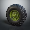 Heavy Duty Off Road Tire With Deep Tread And Green Metal Rim