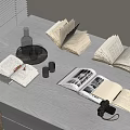 Open Books On White Table With Vintage Camera Glasses Bottle And Candles