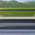 Residential Building With Glass Skylight Overlooking Green Grassland And Mountain Range
