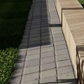 Wooden Landscape Benches Along Paved Path With Green Grass And Tree Shade