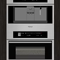 Modern Built in Kitchen Appliances With Double Stacked Ovens Coffee Machines Cabinetry And Interior Lighting