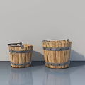 Two Light Wood Buckets With Metal Hoops On Gray Floor Against Light Gray Wall