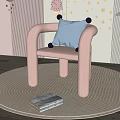 Pink Single Sofa With Blue Cushion On Round Rug And Star Moon Cloud Wall Decor