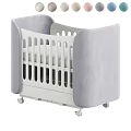 White Baby Crib with Gray Padded Sides Rolling Wheels and Vertical Slats Design
