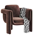 Cozy Red Fabric Accent Chair With Black And White Geometric Pattern Blanket