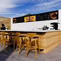 Vibrant Commercial Street With Strooperia Sign Outdoor Seating And Café Tables