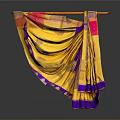 Shiny Gold Red And Purple Sari Hanging On Decorative Rod