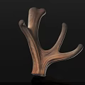Deer Antler Wooden Carving With Brown Textured Surface And Black Background Reflection