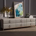 Light Gray Ribbed TV Stand With Metal Handles Decorative Yellow Vase Abstract Painting And Books