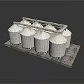 Four White Cylindrical Grain Silos On Gray Platform With Metal Framework