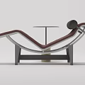 Burgundy Lounge Chair With Metal Frame And Round Concrete Side Table