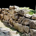 Ancient Stone Wall Structure With Overgrown Grass And Natural Rock Formation 3d model