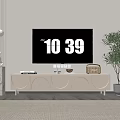 Modern Light Colored TV Stand In Living Room With Decorative Items And Green Plant