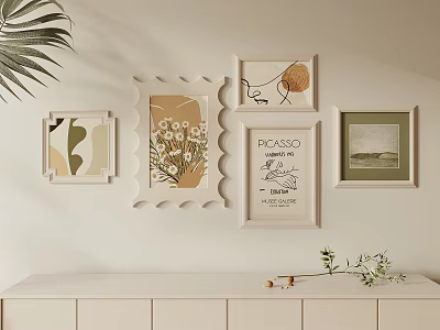 Stylish Wall Decor With Various Framed Artworks Plant And White Cabinet 3d model