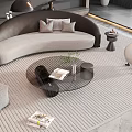 Modern Living Room With Curved Gray Sofa And Glass Coffee Table Set On Woven Rug