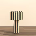 Modern Minimalist Table Lamp With Black And White Striped Lampshade And Base On Wooden Floor