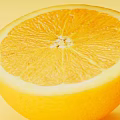 Visual Display of Fresh and Vibrant Oranges Sliced and Whole on Yellow Background