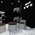 Modern Café With Black Walls White Decorative Flowers Round Tables HELLO Sign And Snowy Decor