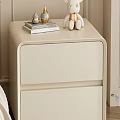 White Nightstand with Open Drawers Holding Magazines Books Topped with Lamp Decor