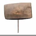 Other Square Metal Object With Textured Surface And Long Thin Rod