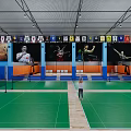 Indoor Basketball Court Interior With Wooden Floor Orange Seats Hoop And Center Logo