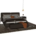 Modern Double Bed with Soft Pillows Bedside Tables and Orange Throw Blanket
